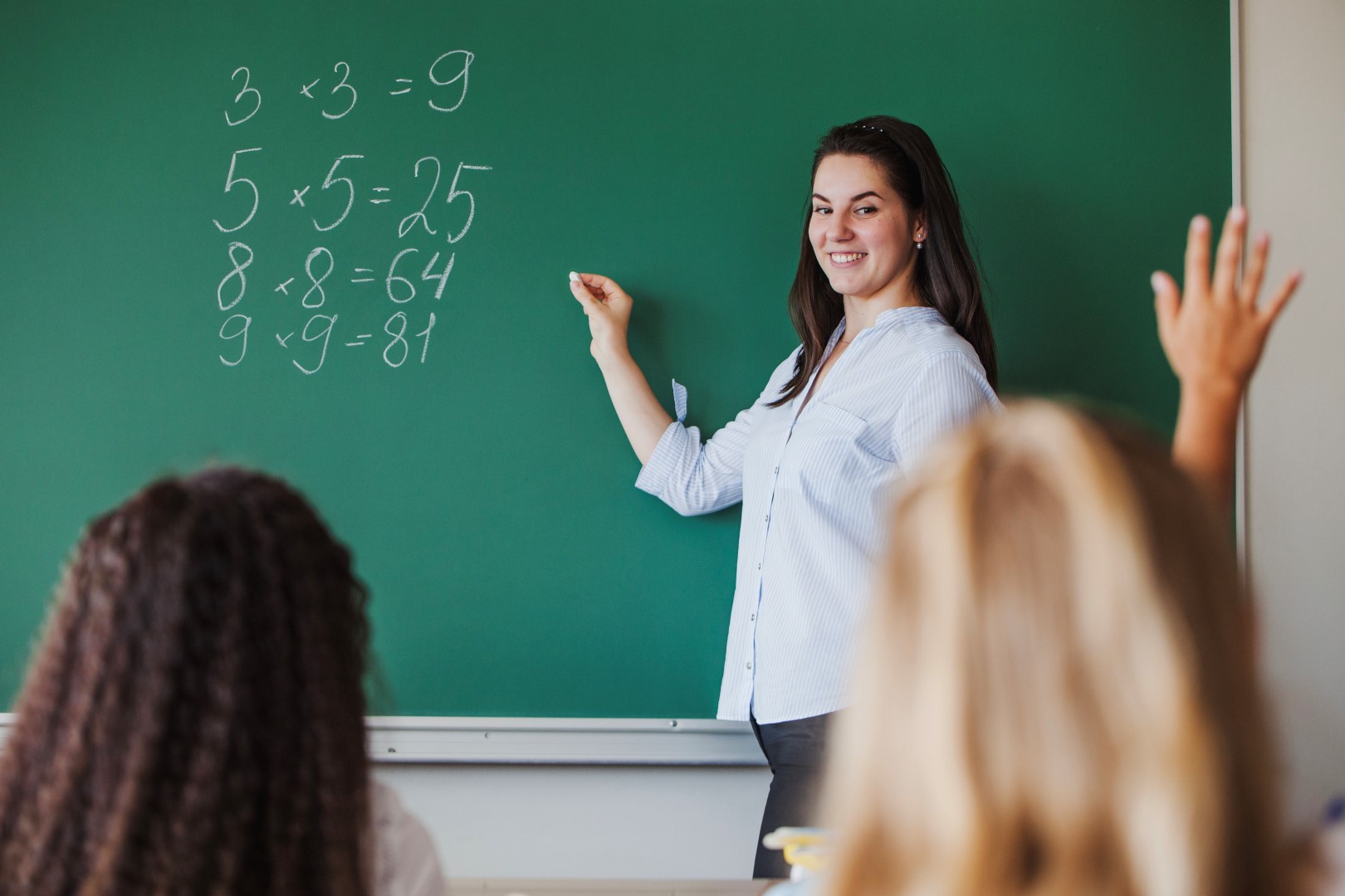 Teacher leading students in class